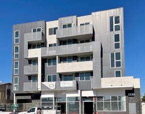 Los Angeles apartment for rent - A large concrete building with the letters "CS" on the front.