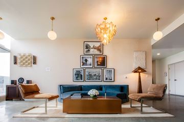Los Angeles apartment for rent - A living room with a blue couch and a coffee table.