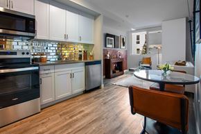 Los Angeles apartment for rent - A modern kitchen with a dining table and chairs.