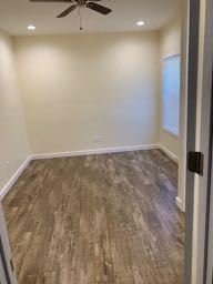 Los Angeles apartment for rent - A room with a ceiling fan and lighting fixtures.