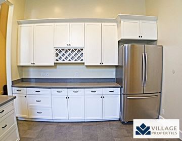 San Francisco apartment for rent - a kitchen with white cabinets and a stainless steel refrigerator