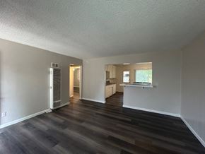 Ontario apartment for rent - A room with a wooden floor and white walls.