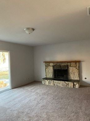 Alta Loma house for rent - an empty living room with a stone fireplace