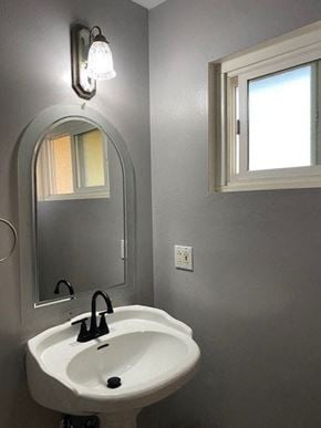 Alta Loma house for rent - a bathroom with a white sink and a mirror