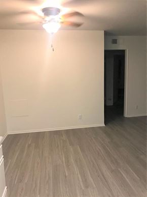 Glendale apartment for rent - A room with a ceiling fan and light fixture.