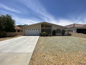 Victorville apartment for rent - a house with a driveway and a garage door