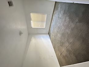 Victorville house for rent - A bathroom with a shower and a window.