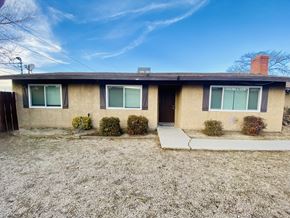 Apple Valley triplex for rent - A house with a brown roof and a white door.