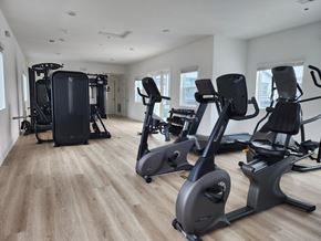 Fontana townhouse for rent - A spacious gym with a variety of cardio equipment.