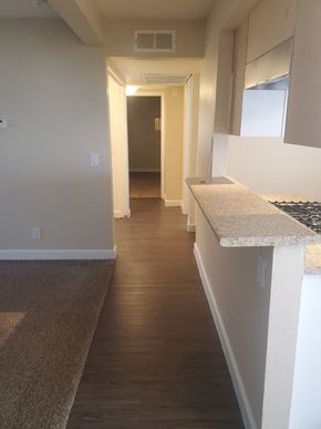Ontario apartment for rent - a view of the hallway from the kitchen and living room of a new home