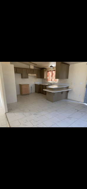 Adelanto house for rent - A kitchen with a counter and a sink.