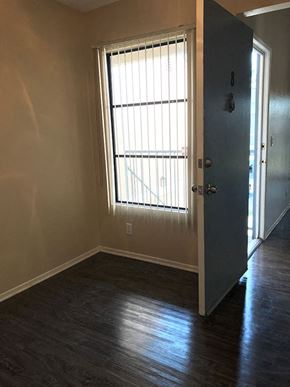 Ontario apartment for rent - an empty room with a large window and a door