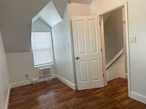 Pomona house for rent - an empty room with a door and a window
