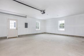 Brunswick apartment for rent - A room with a door, a window, and a ceiling fan.