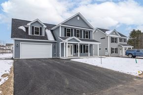 Brunswick apartment for rent - A large house with a grey roof and a white garage door.