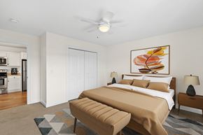 Westbrook apartment for rent - a bedroom with a bed and a ceiling fan