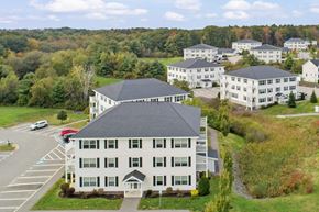 Westbrook apartment for rent - an aerial view of a large white building with other buildings in the background