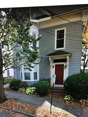 Portland apartment for rent - a house with a red door on a street