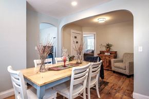 South Portland apartment for rent - A dining room with a wooden table and chairs.