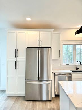 Scarborough townhouse for rent - a kitchen with white cabinets and a stainless steel refrigerator