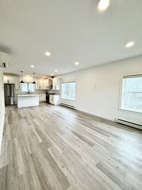 Scarborough townhouse for rent - the living room and kitchen of a new home with wood flooring