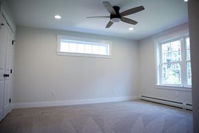 Brunswick apartment for rent - a living room with a ceiling fan and a window