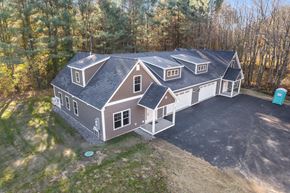 Saco triplex for rent - a birds eye view of a house with a gambrel roof