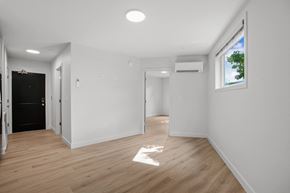 Biddeford apartment for rent - a living room with white walls and a window and wooden floors