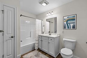 Westbrook apartment for rent - a white bathroom with a shower toilet and sink