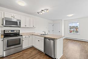 Westbrook apartment for rent - A kitchen with white cabinets and stainless steel appliances.