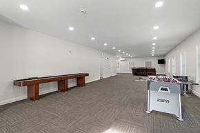 Brunswick apartment for rent - a game room with a pool table and a foosball table in the corner
