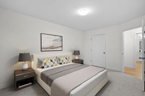 Scarborough apartment for rent - A bedroom with a bed, nightstands, and a painting on the wall.