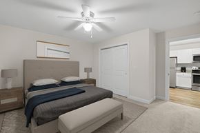 Westbrook apartment for rent - a bedroom with a bed and a ceiling fan