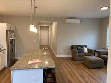 Scarborough condo for rent - a living room with a kitchen and a couch