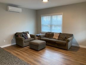 Scarborough condo for rent - a living room with a couch and a chair
