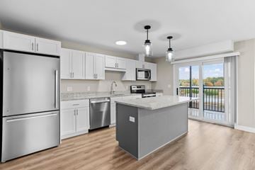 Scarborough apartment for rent - A kitchen with a refrigerator, microwave, and dishwasher.