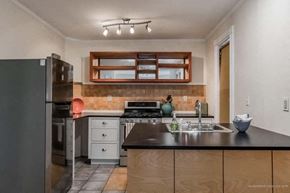 Portland apartment for rent - a kitchen with a stove and a sink and a refrigerator