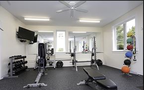 Westbrook apartment for rent - a home gym with exercise equipment and a ceiling fan