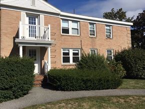 Portland apartment for rent - a brick house with a balcony and a walkway