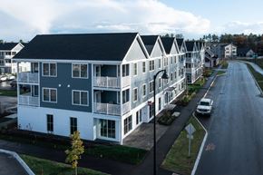 Scarborough apartment for rent - A street view of a row of houses with cars parked on the side.