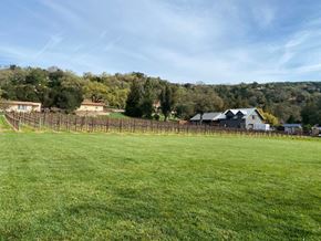Sonoma apartment for rent - a vineyard in a field with a house in the background