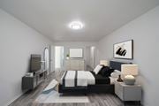 Jacksonville apartment for rent - A modern bedroom with a large bed and a television. at Red Bay Apartment Complex, Jacksonville, FL, 32211