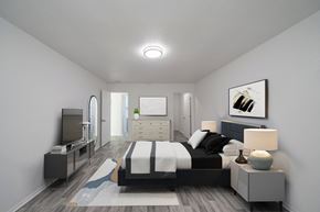 Jacksonville apartment for rent - A modern bedroom with a large bed and a television. at Red Bay Apartment Complex, Jacksonville, FL, 32211
