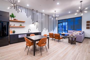 Oakley apartment for rent - A modern kitchen with a dining table and chairs.