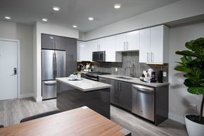 Milpitas apartment for rent - a kitchen with white cabinets and stainless steel appliances