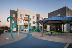 Sacramento apartment for rent - a playground and pavilion in a courtyard of an apartment building