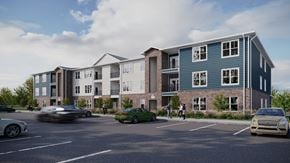 Louisville apartment for rent - A modern apartment complex with cars parked in the lot at Shepherd Springs Apartments, Louisville