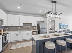 Bowling Green apartment for rent - A modern kitchen with a large island and bar stools.
