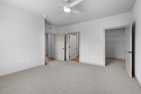 Whiteland apartment for rent - A spacious room with a ceiling fan and carpeted floor.at Allure Apartments LLC, Whiteland, IN 46184