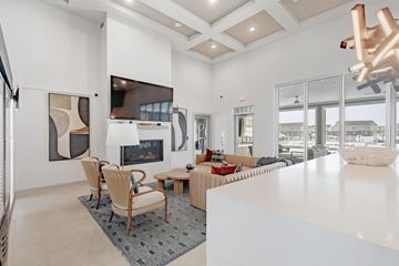 Franklin apartment for rent - A modern living room with a fireplace and a large painting on the wall.